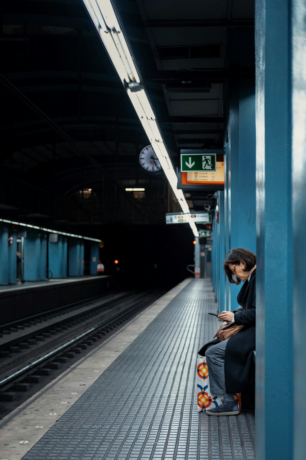 woman sitting inside subway