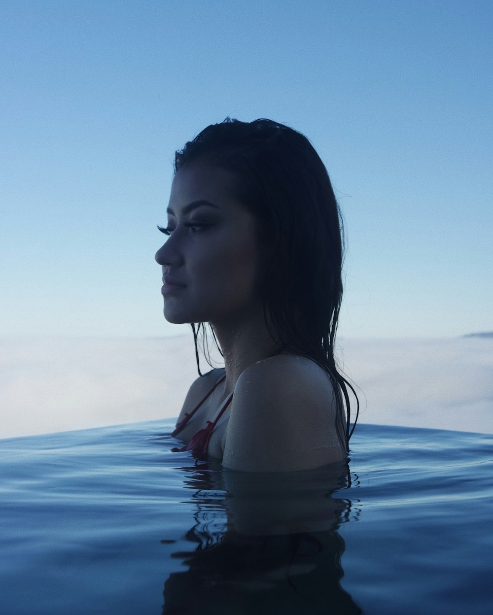 woman in body of water during daytime