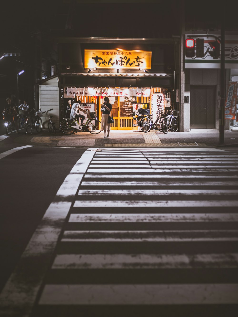 people riding bicycles on road during night time