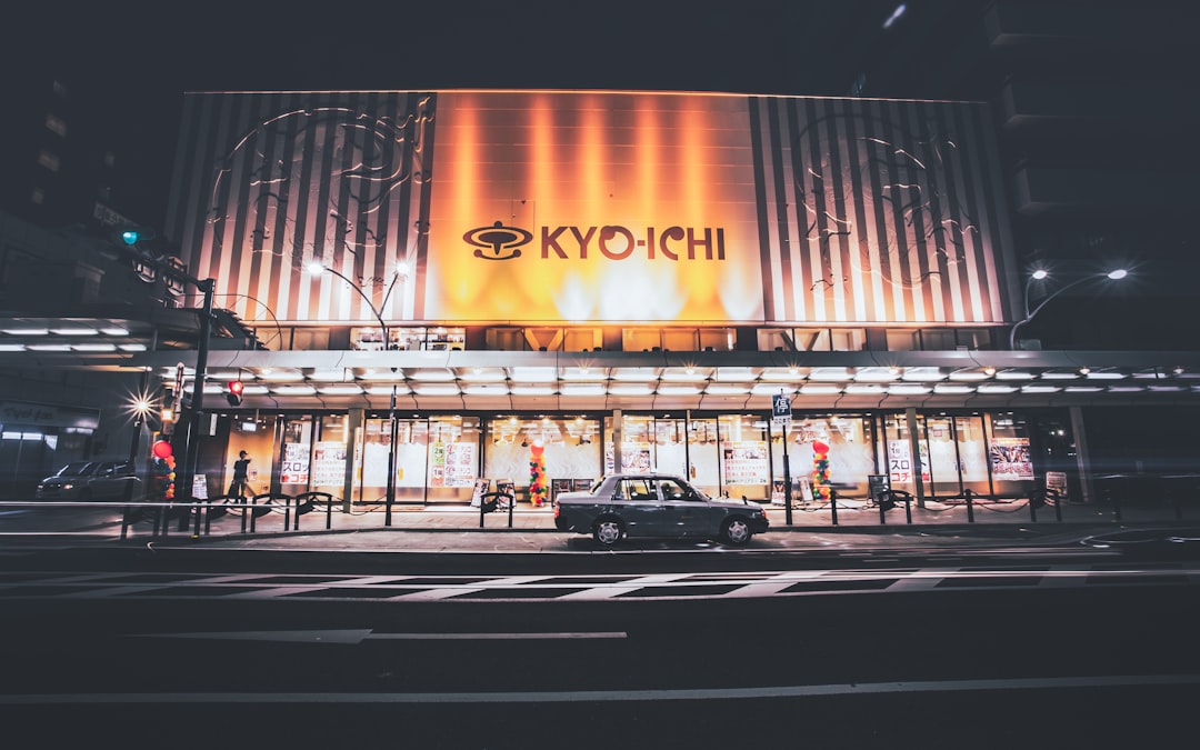 cars parked in front of building during night time