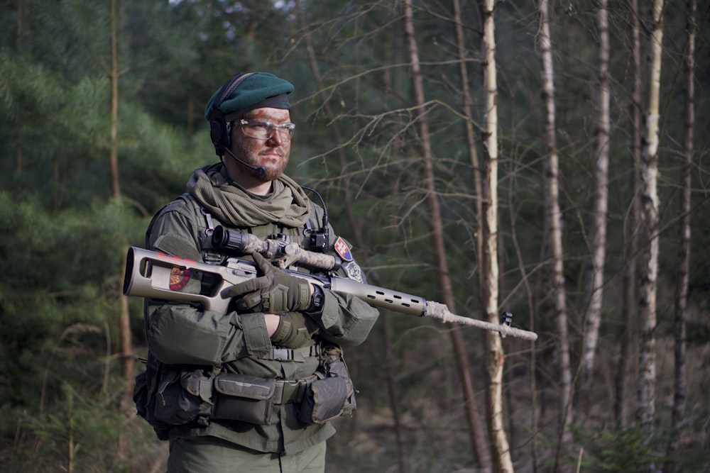 soldier man holding assault rifle standing