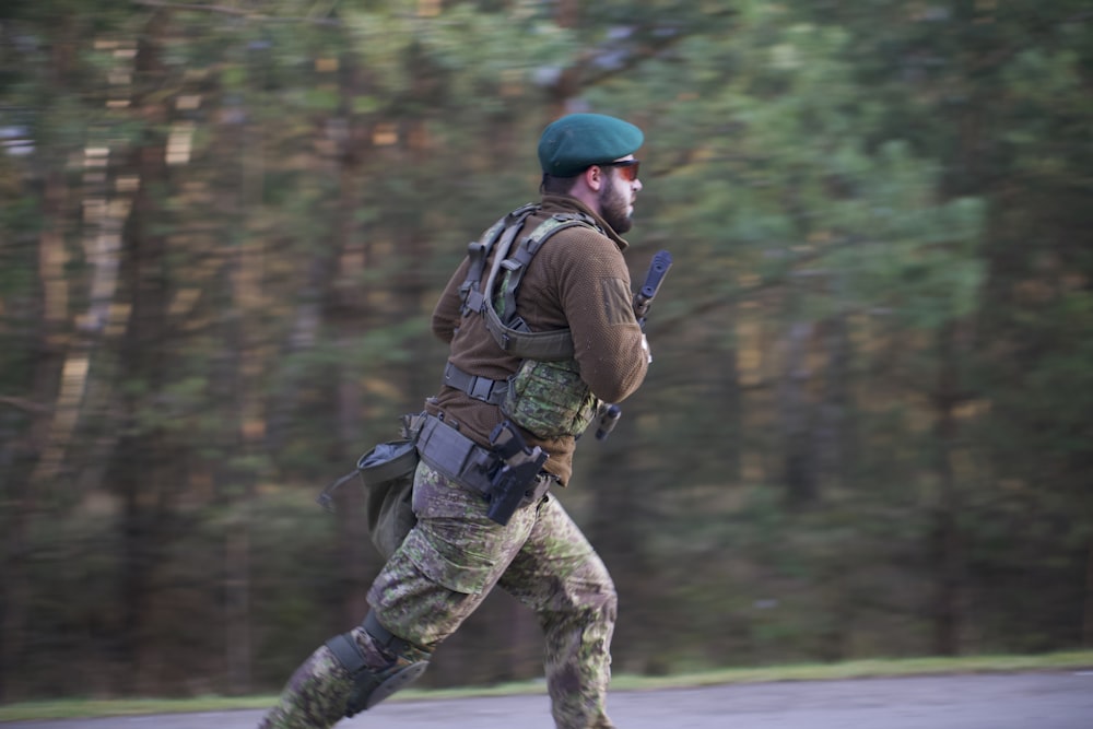 soldier man wearing sunglasses running on road