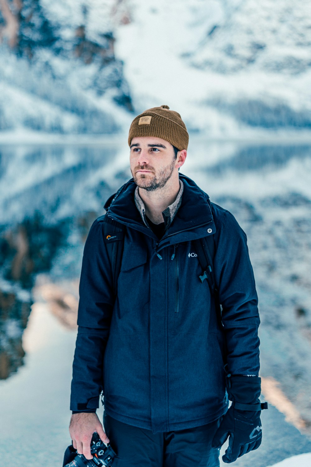 selective focus photography of man wearing jacket near outdoor during daytime