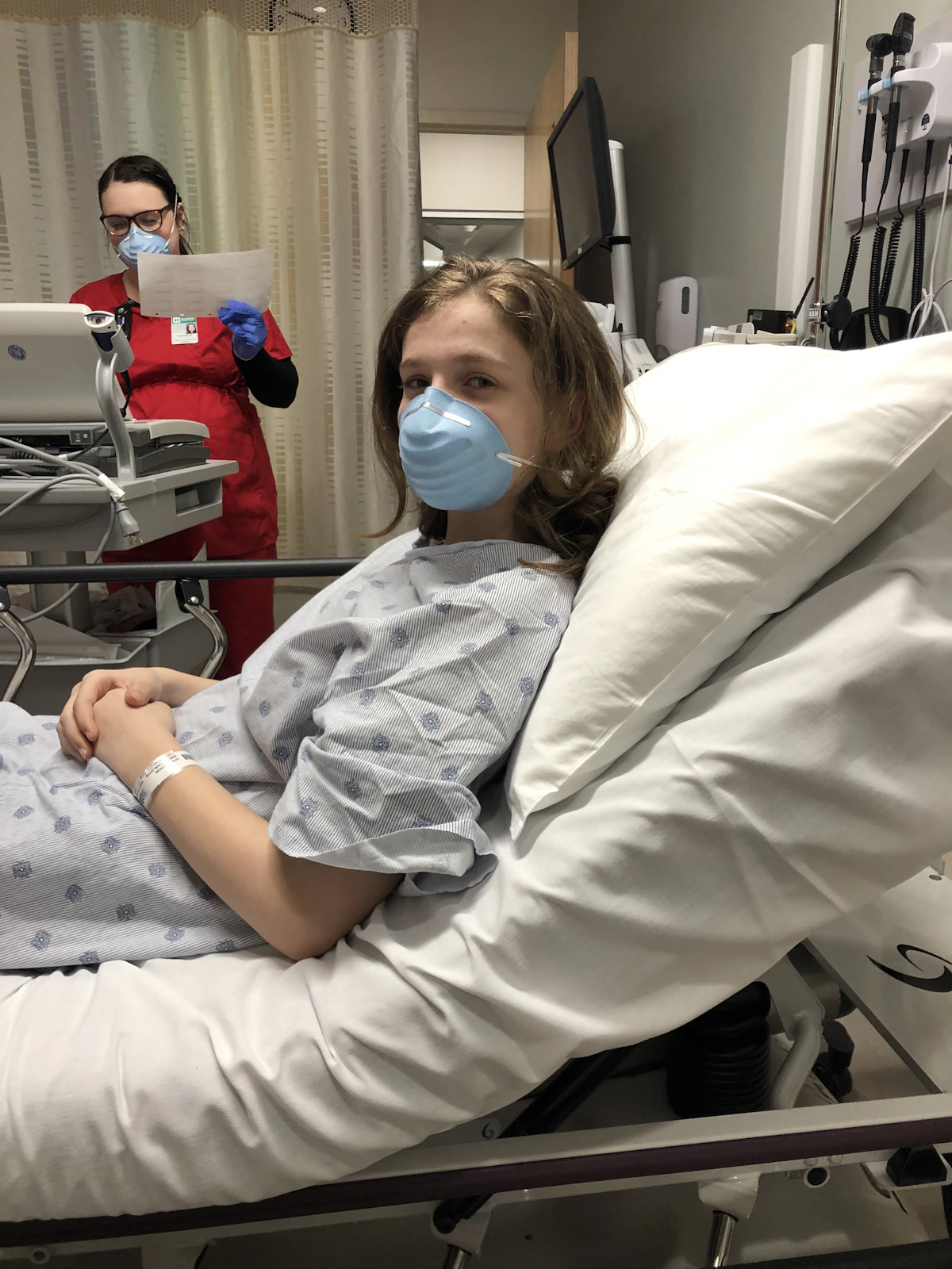 Woman lying on a hospital bed awaiting her delivery