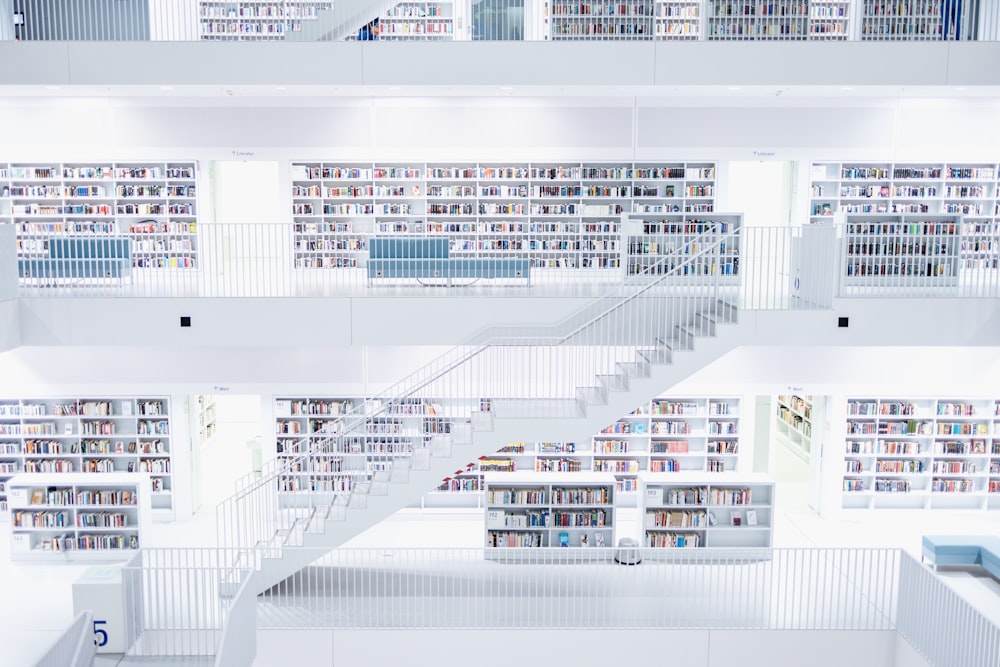 multi-story white painted library interior