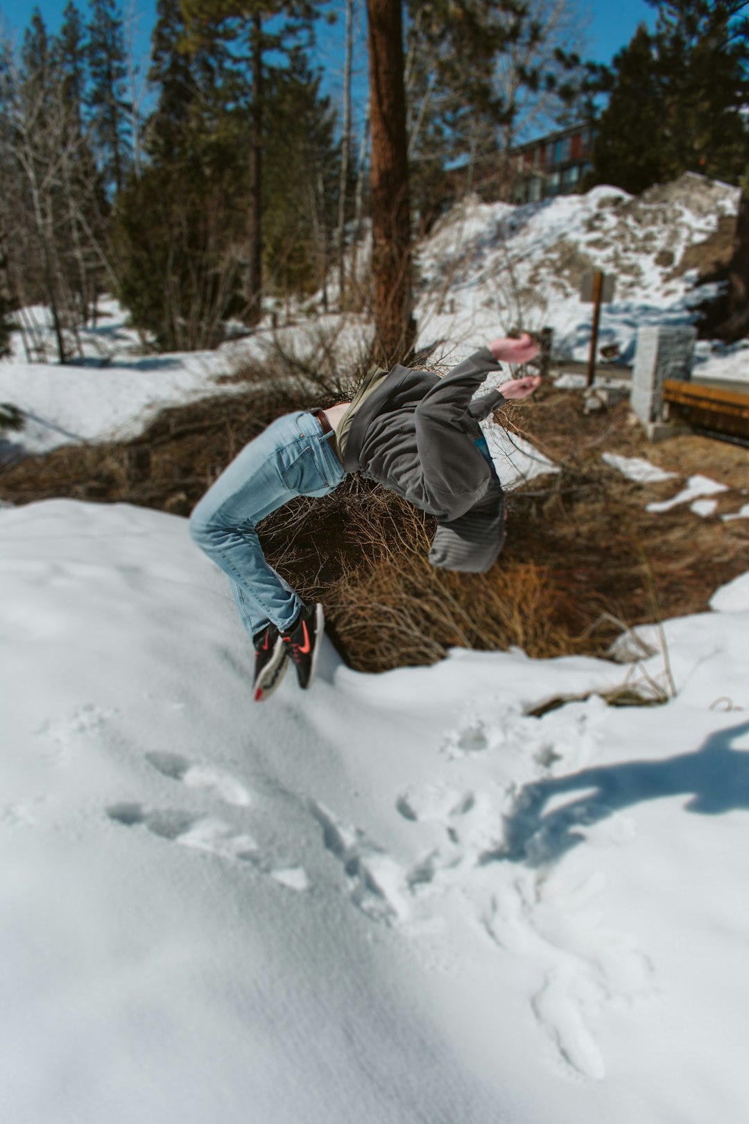 person doing backflip on snow