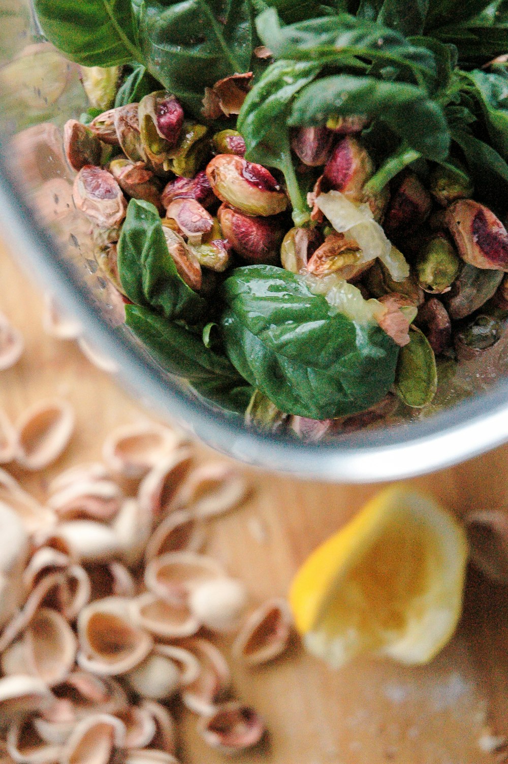 a blender filled with spinach and other ingredients