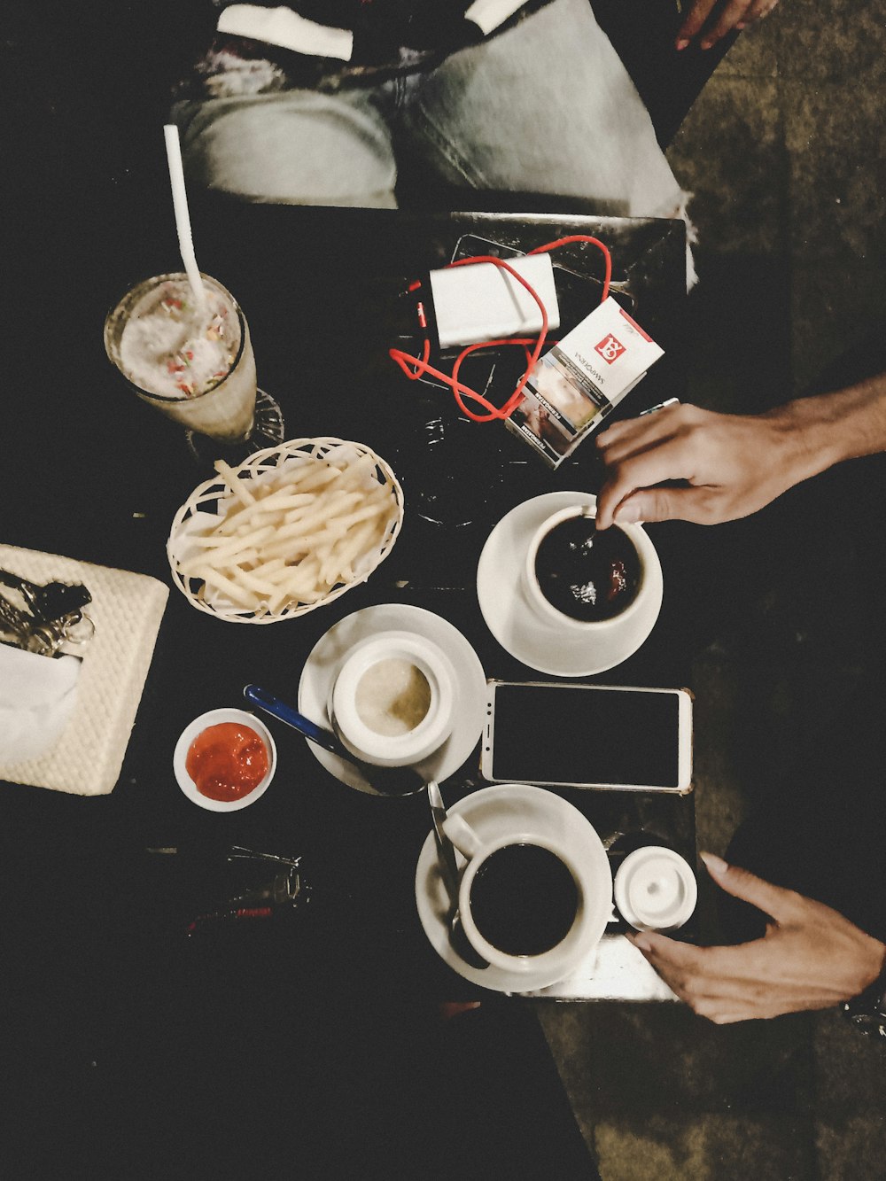 flat lay photography of three white ceramic mugs on saucers