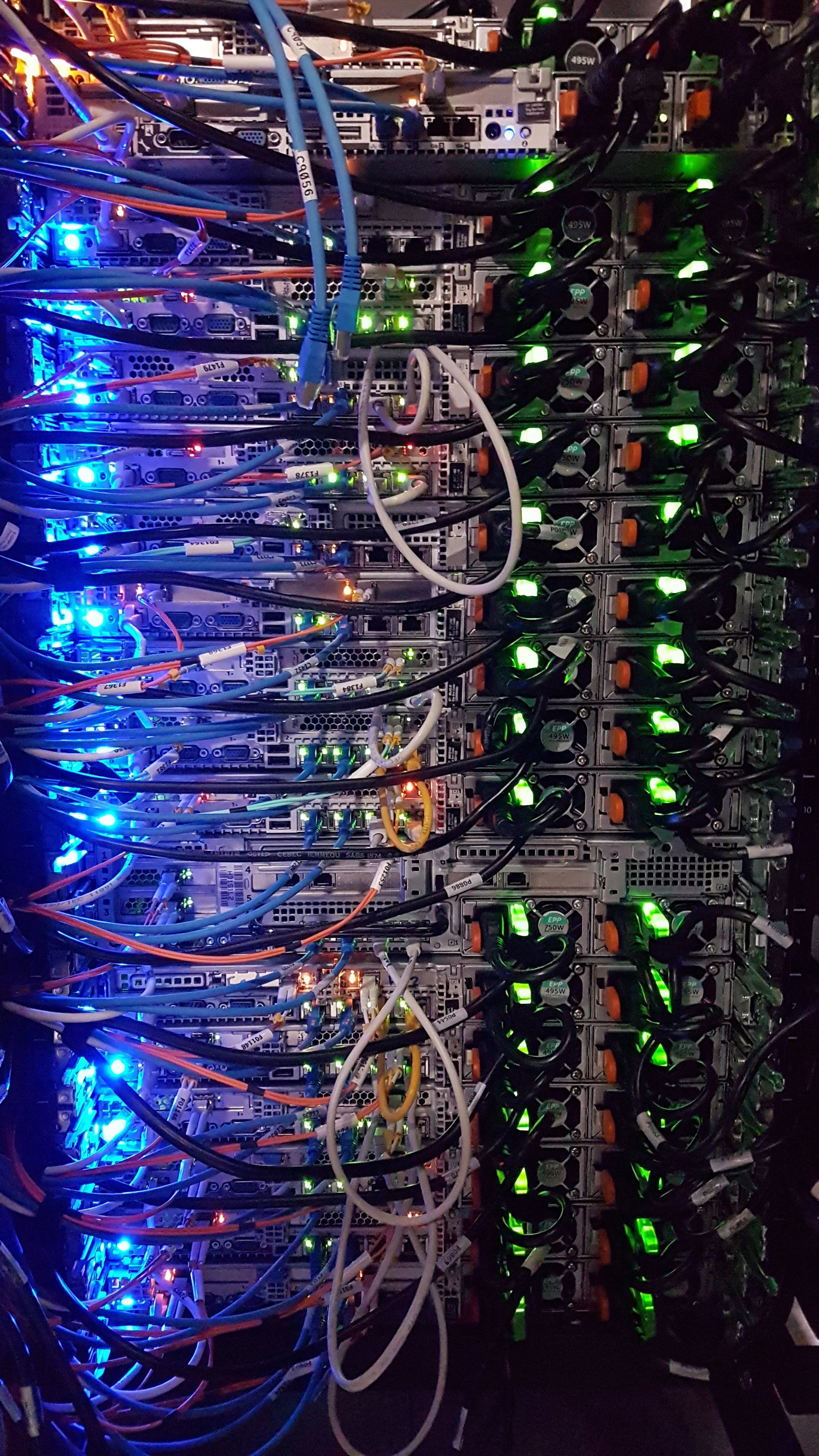 A dense cable bundle inside a server cabinet — what real systems actually look like under the polite UI