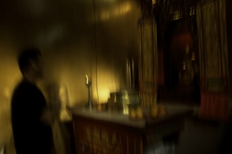 Dark mystical altar with candles and esoteric symbols glowing in blue and black tones.