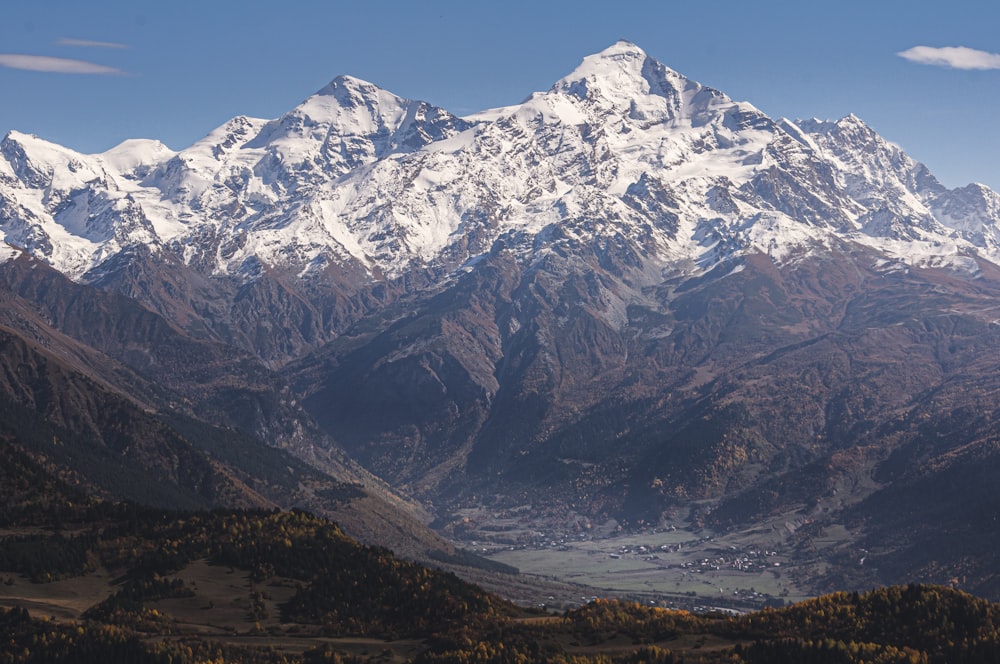 snow covered mountain during daytime