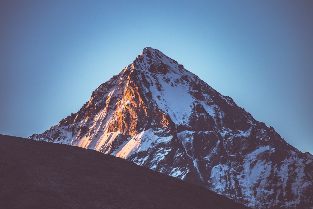 snow covered mountain under blue sky during daytime