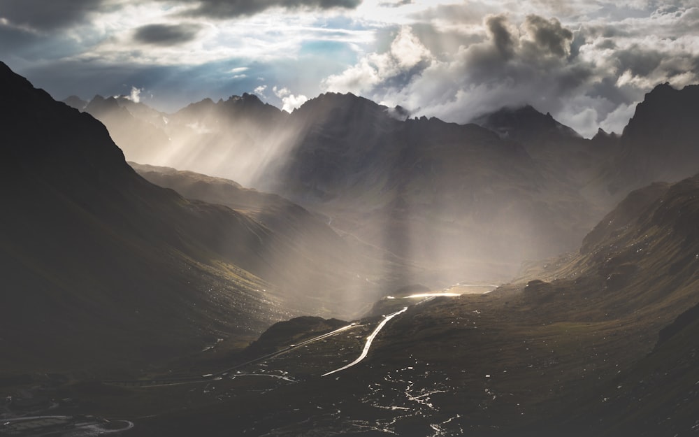 mountains under white clouds during daytime