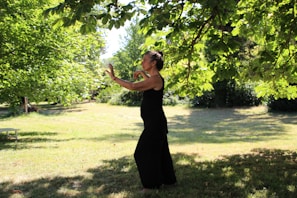 A group of people practicing Tai Chi in a tranquil park.
