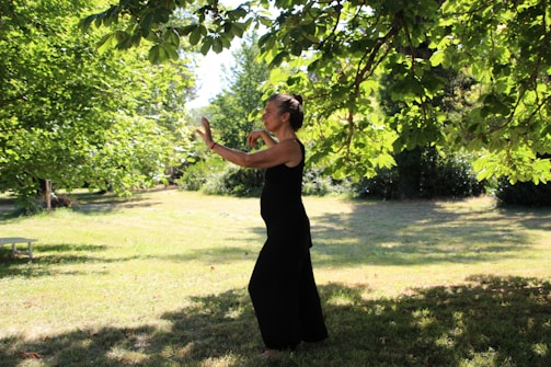 A serene outdoor scene of people practicing tai chi in a park.