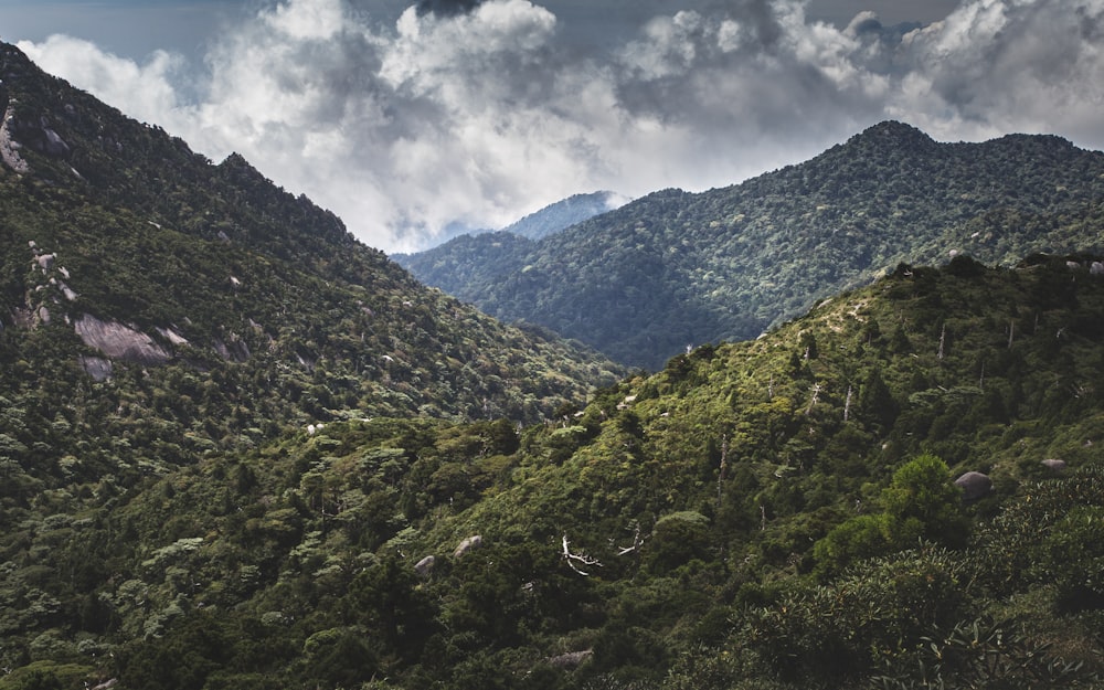 green mountains under white clouds during daytime