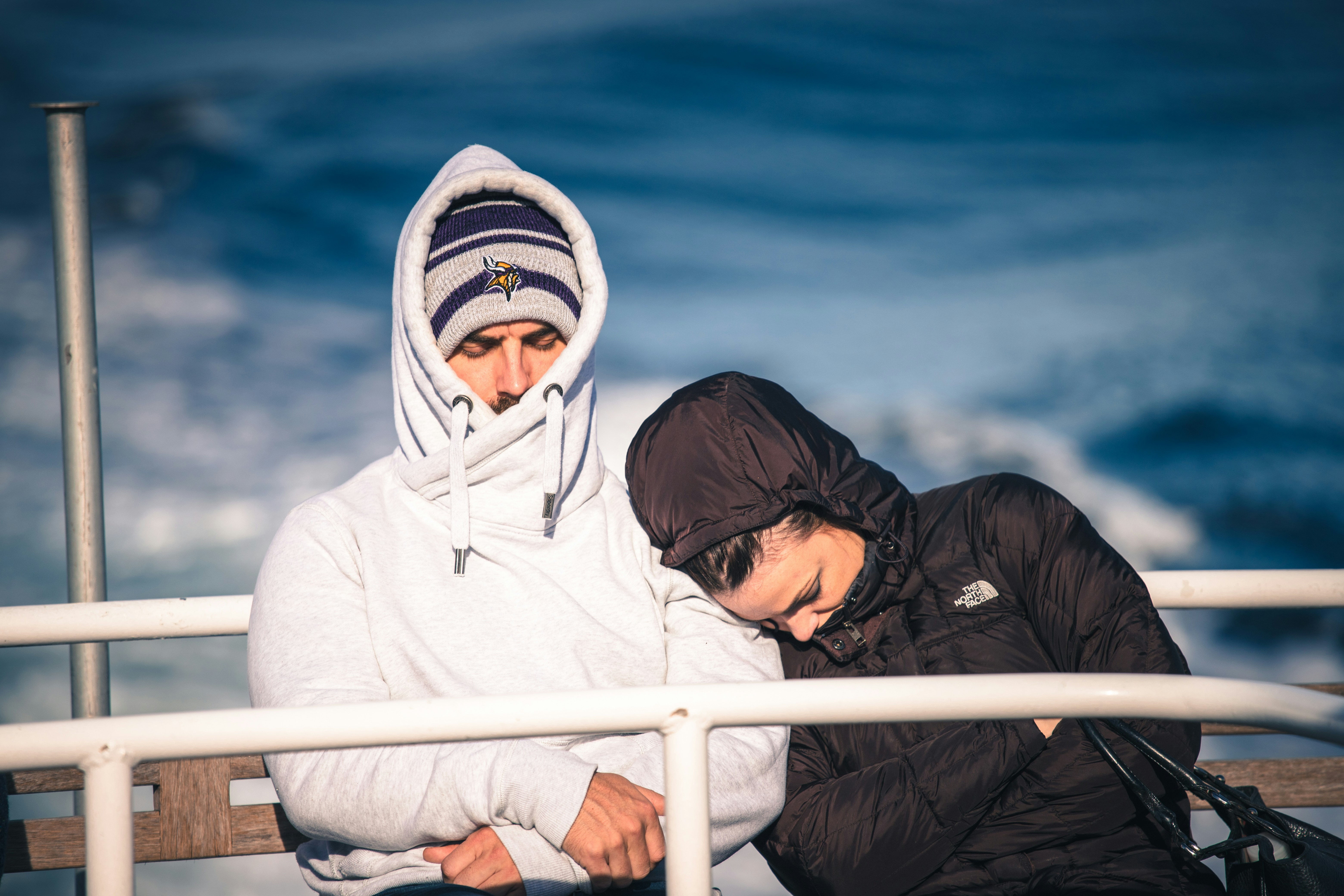 person in white and black hoodie wearing white and orange mask