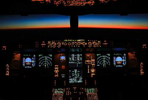 Immersive motion simulator cockpit glowing with dynamic lighting effects simulating flight.