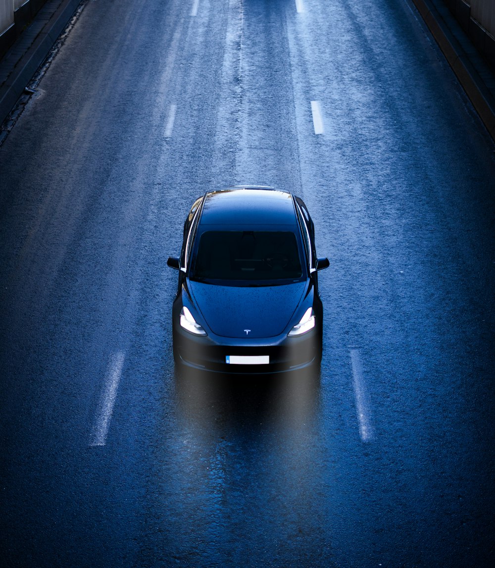 blue car on road during daytime