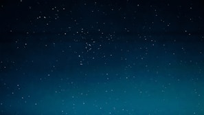 A serene night sky filled with twinkling stars over a calm landscape, symbolizing guidance and clarity.