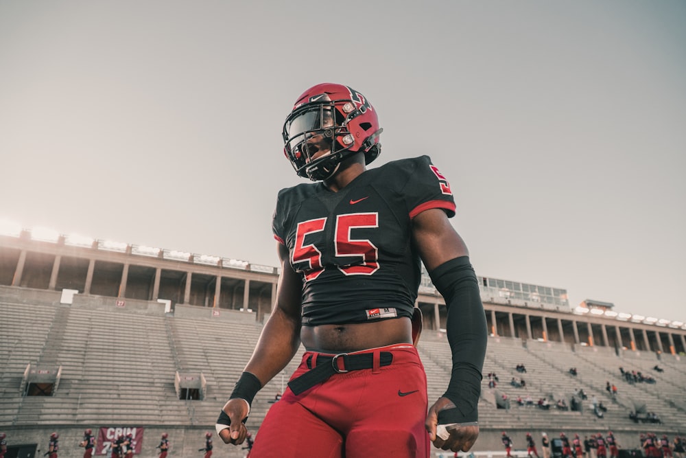 football player in red jersey shirt and red pants