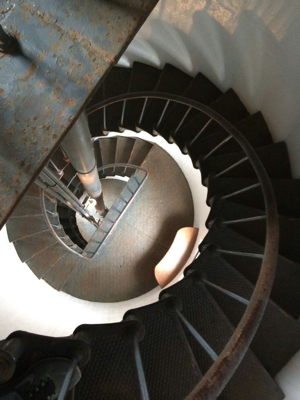 black spiral staircase with stainless steel railings