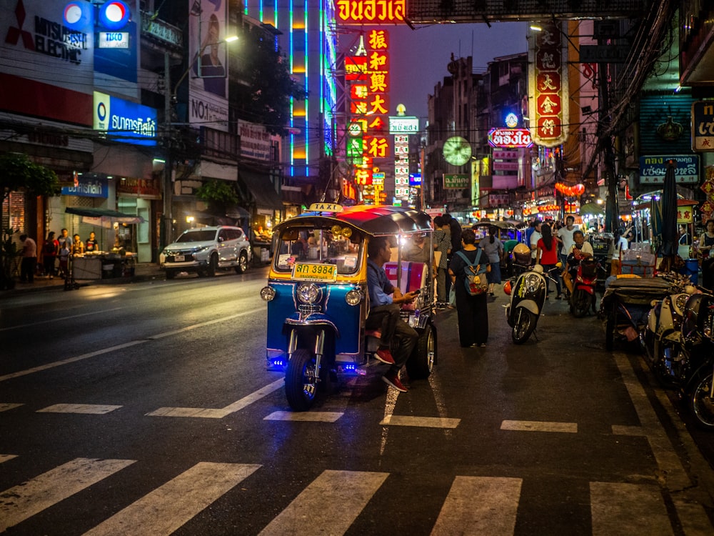 people riding on motorcycle on road during night time