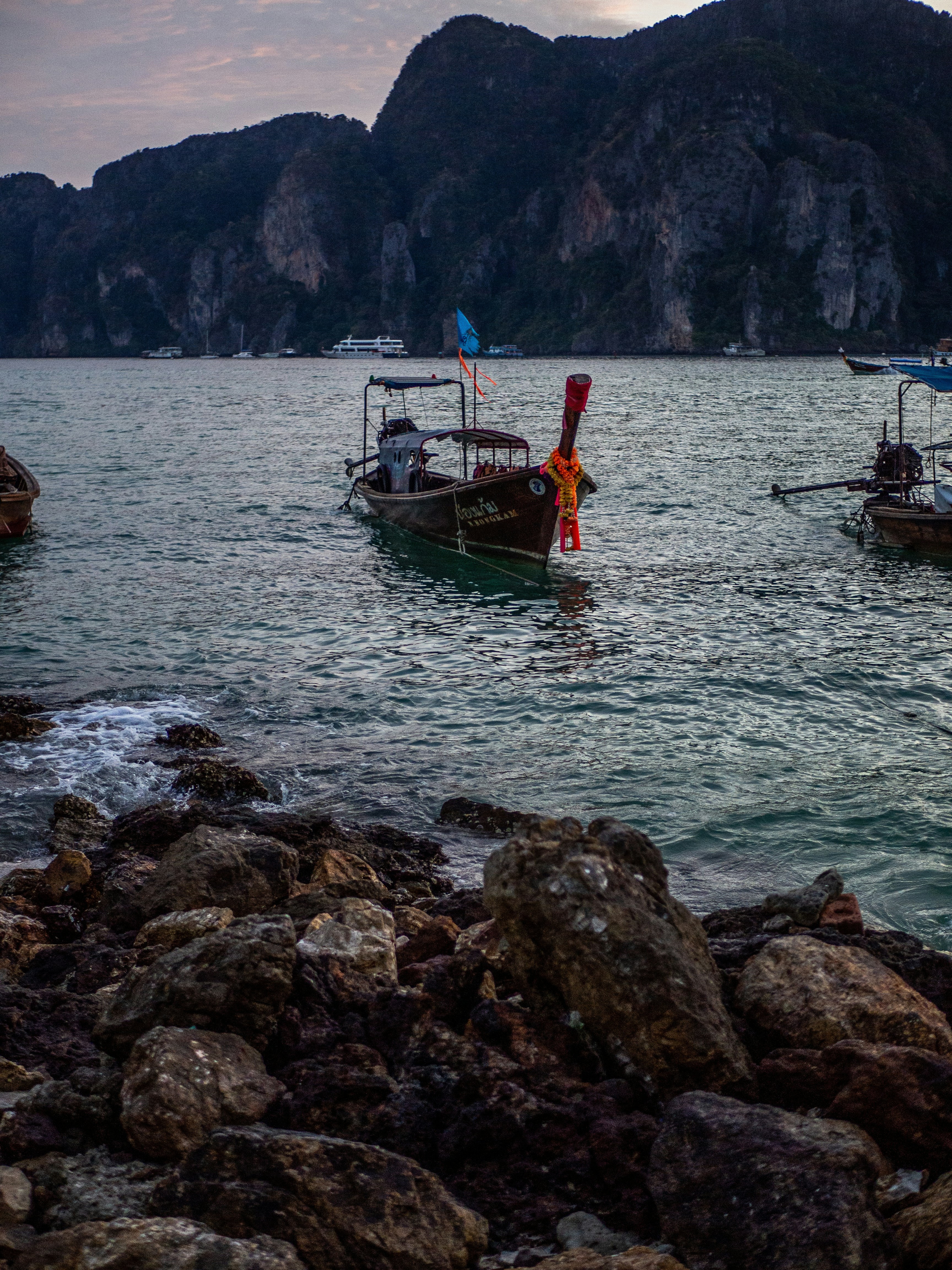 red and white boat on body of water during daytime