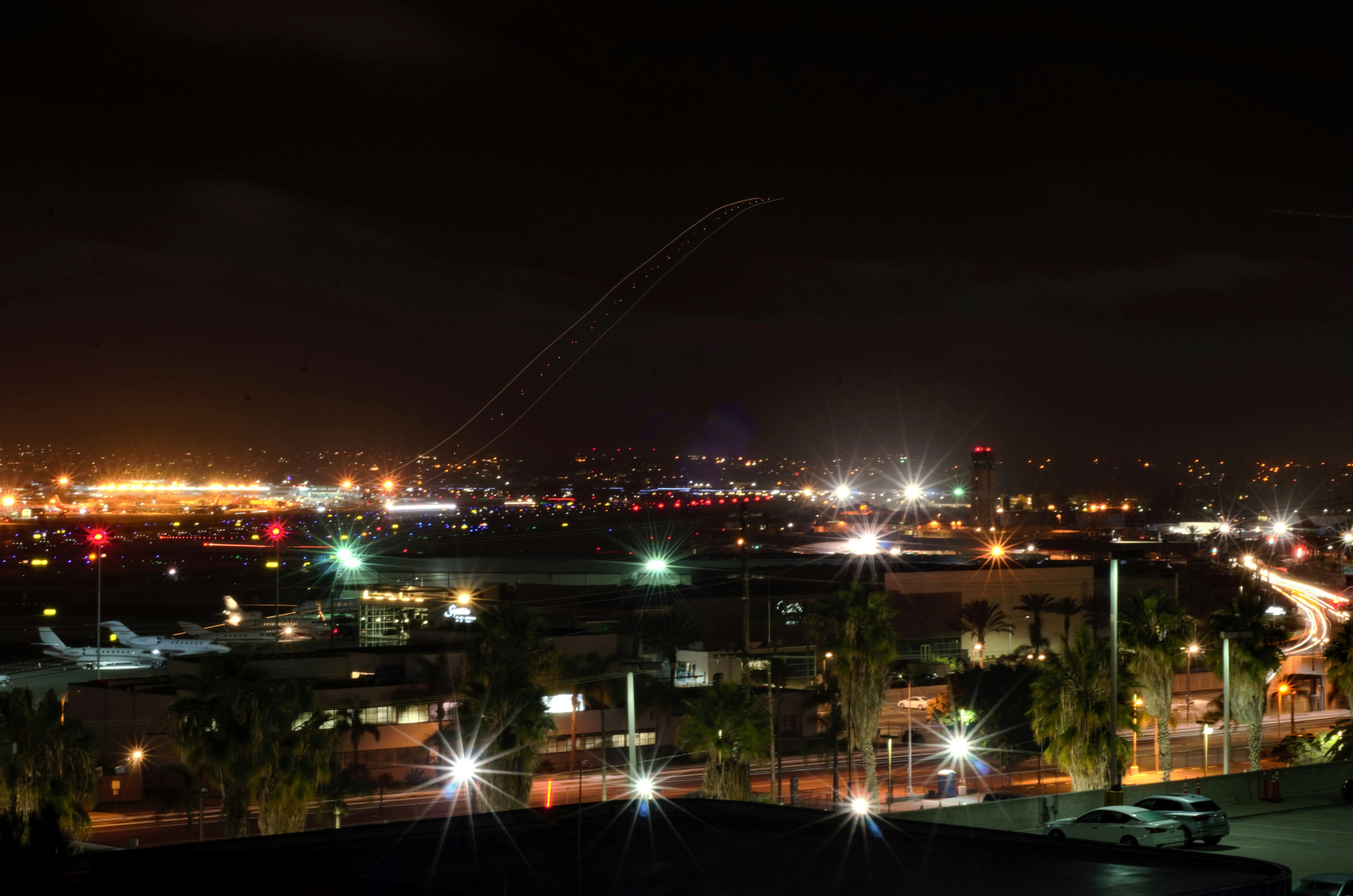 Commercial airplane taking off at night from a runway