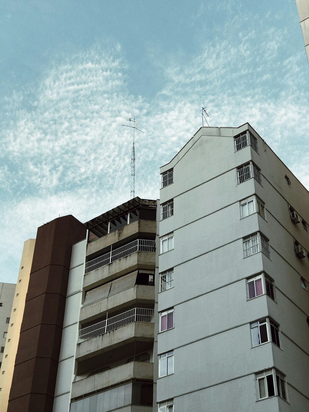 white and brown concrete building under blue sky during daytime