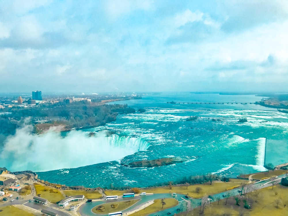 aerial view of city near body of water during daytime