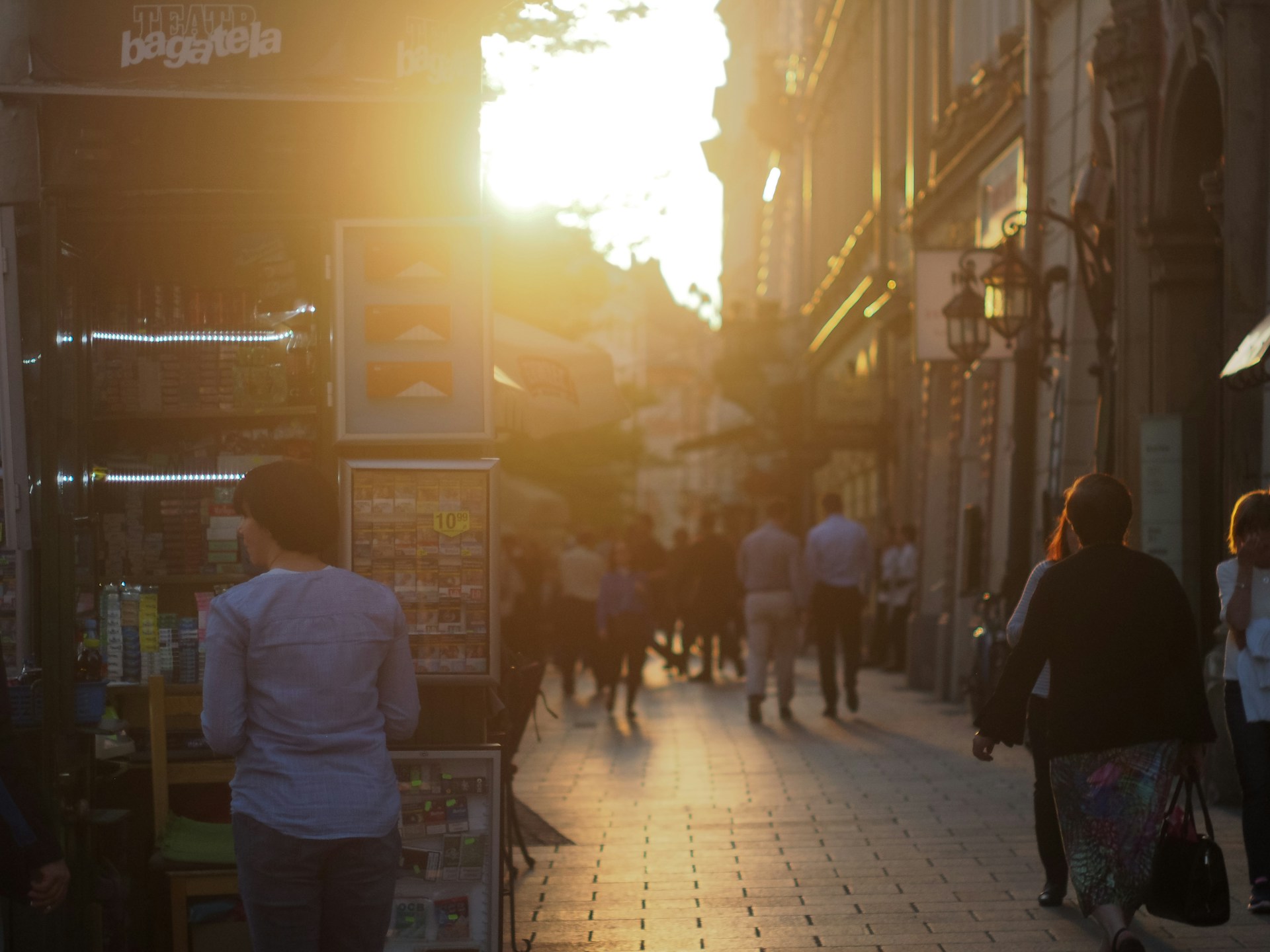 woman wearing yellow long-sleeved dress under white clouds and blue sky during daytime