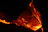 Close-up of black carbon-ceramic composite fiber strands glowing under intense heat.