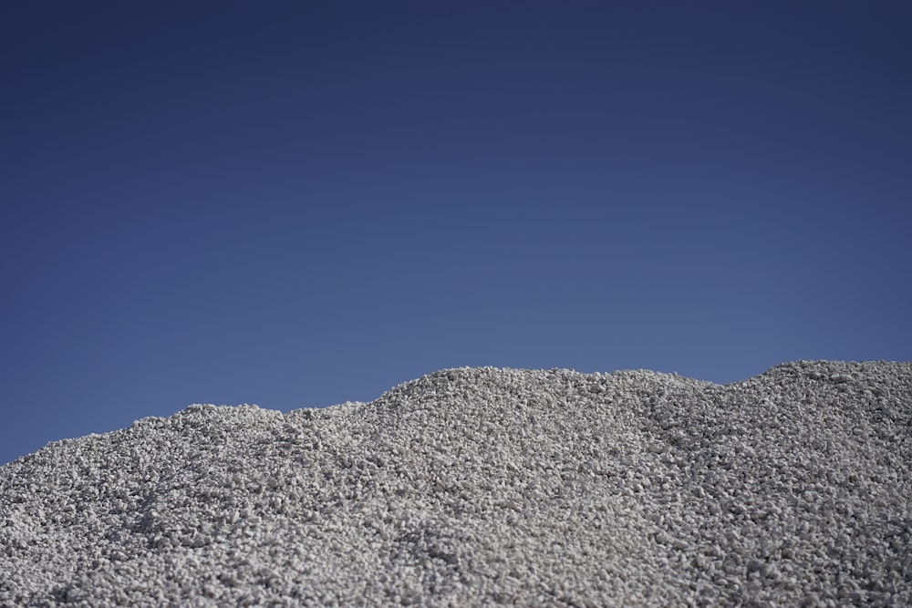 gray rocky mountain under blue sky during daytime