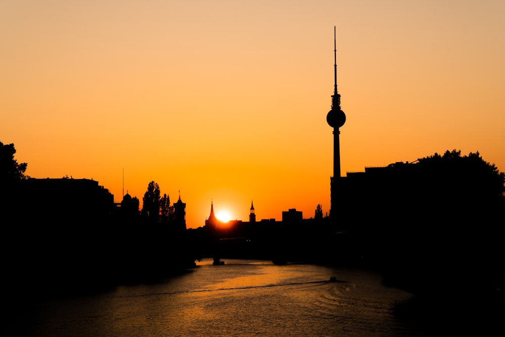 silhouette of city buildings during sunset