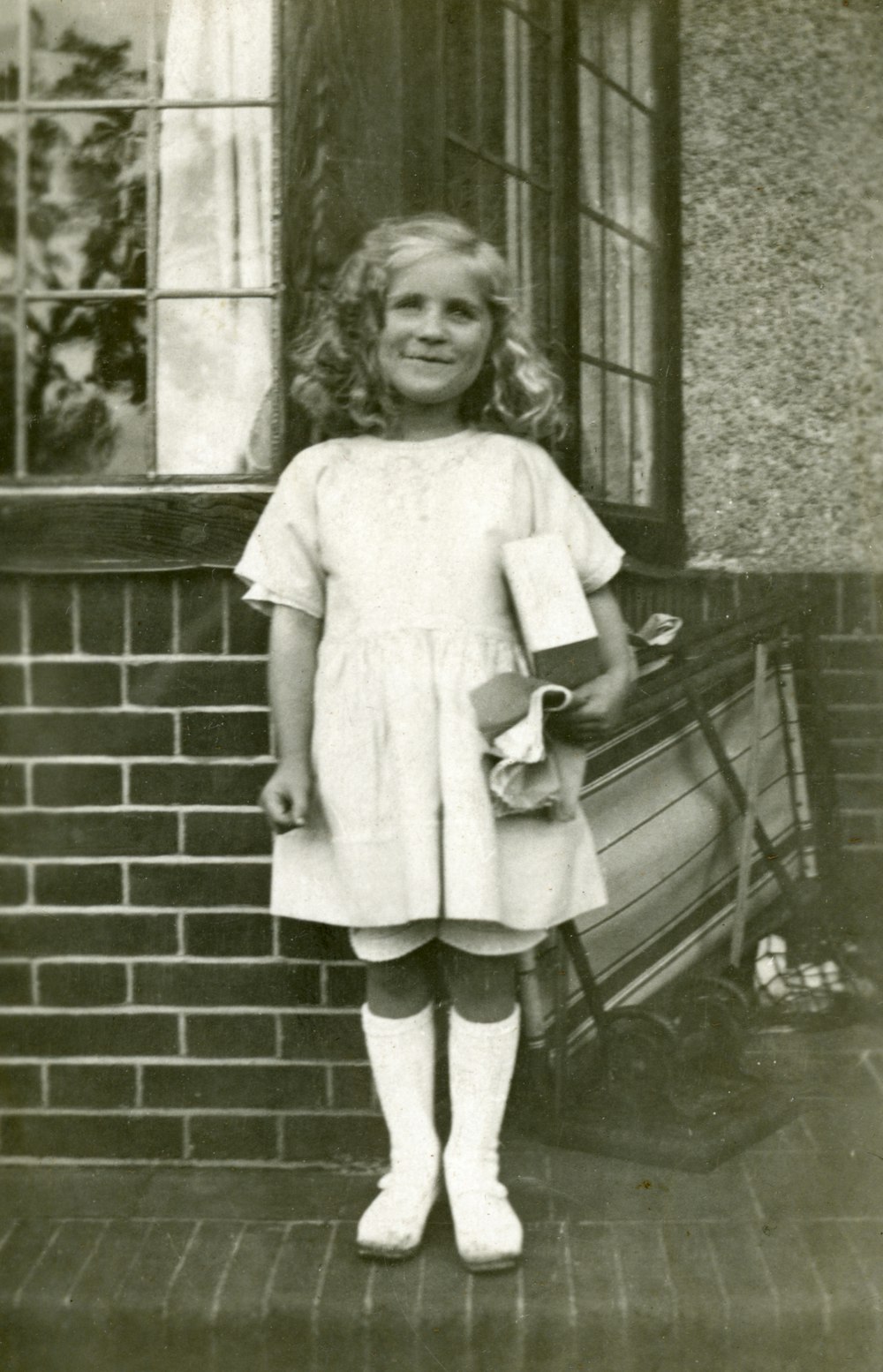 girl in white dress standing on the stairs