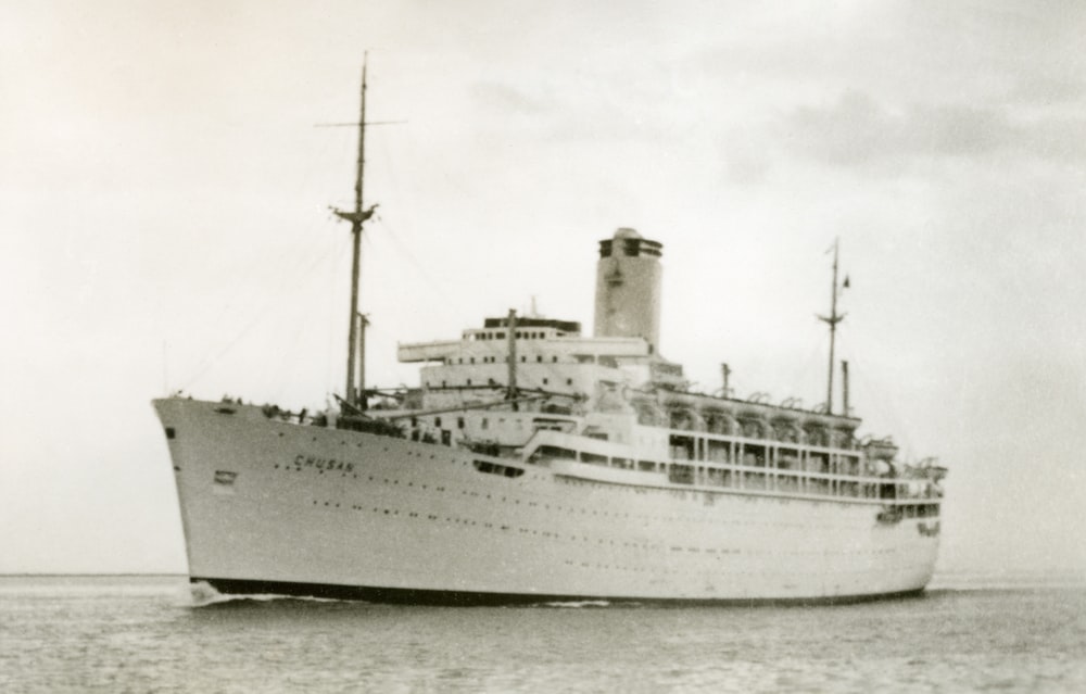 white ship on body of water during daytime