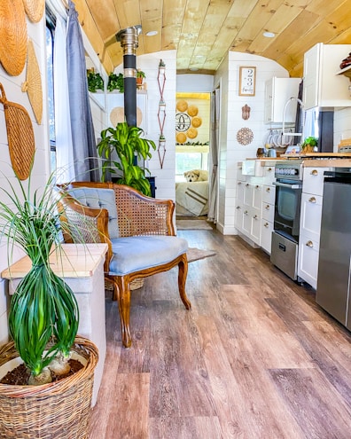 Interior view of a cozy, solar-powered mobile home with wooden finishes.