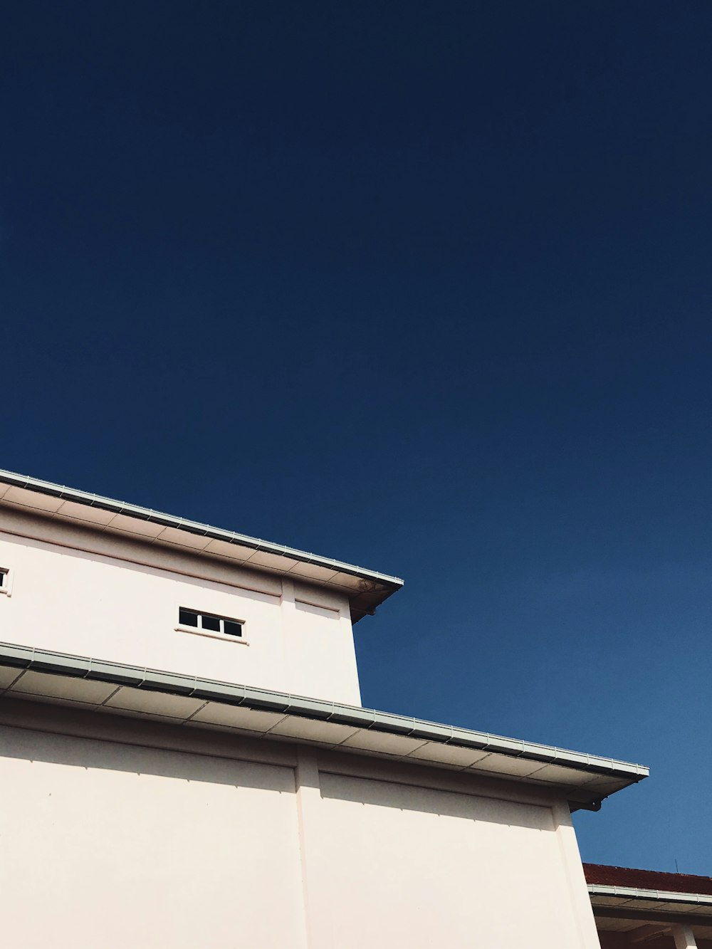 white concrete building under blue sky during daytime