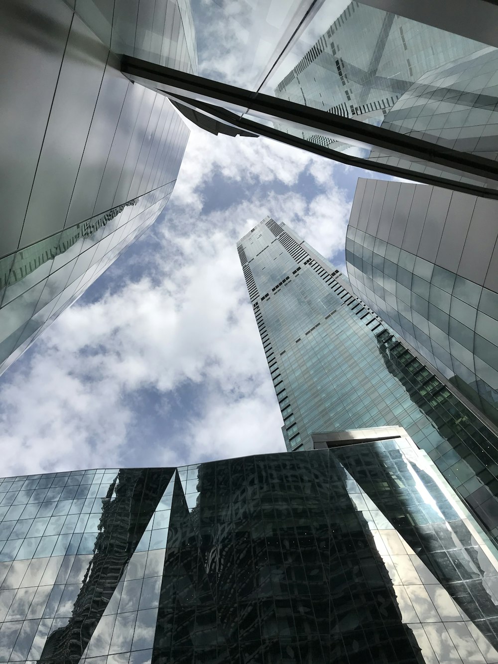 low angle photography of high rise building under blue sky during daytime