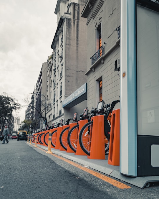 orange and black traffic cones on gray asphalt road during daytime in Buenos Aires Argentina