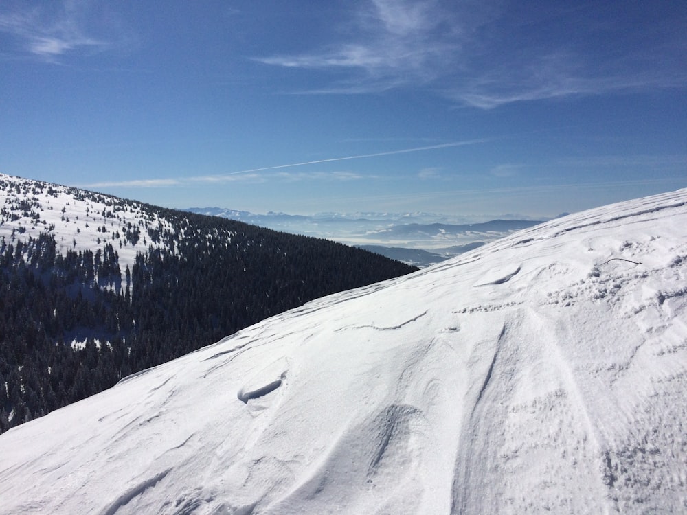 snow covered mountain under blue sky during daytime