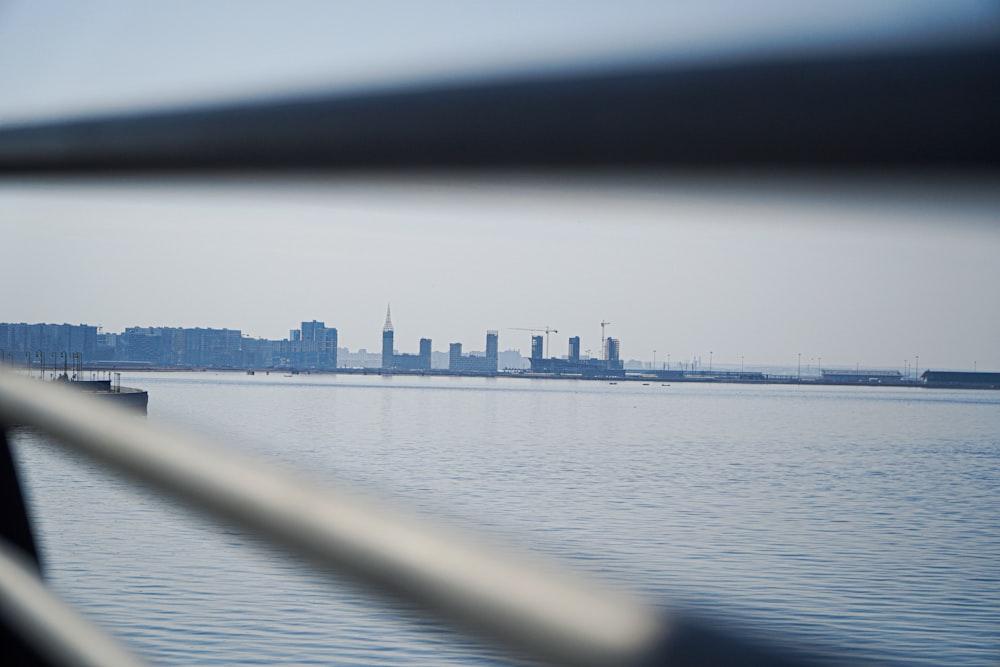 body of water near city buildings during daytime