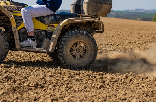 person riding on black atv in Gers France