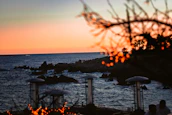 Scenic view of Santa Catarina’s coastline with a sunset background.