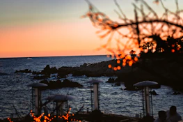 Scenic view of Santa Catarina’s coastline with a sunset background.