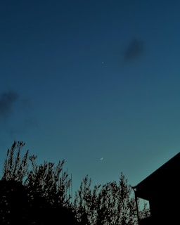 A serene Libra symbol balanced delicately on a cosmic scale under a twilight sky.