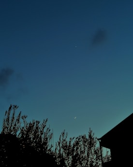 A serene Libra symbol balanced delicately on a cosmic scale under a twilight sky.