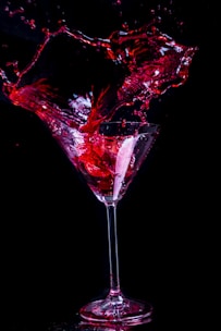 A striking black-and-red themed still from a brand film showing a dynamic moment of storytelling.