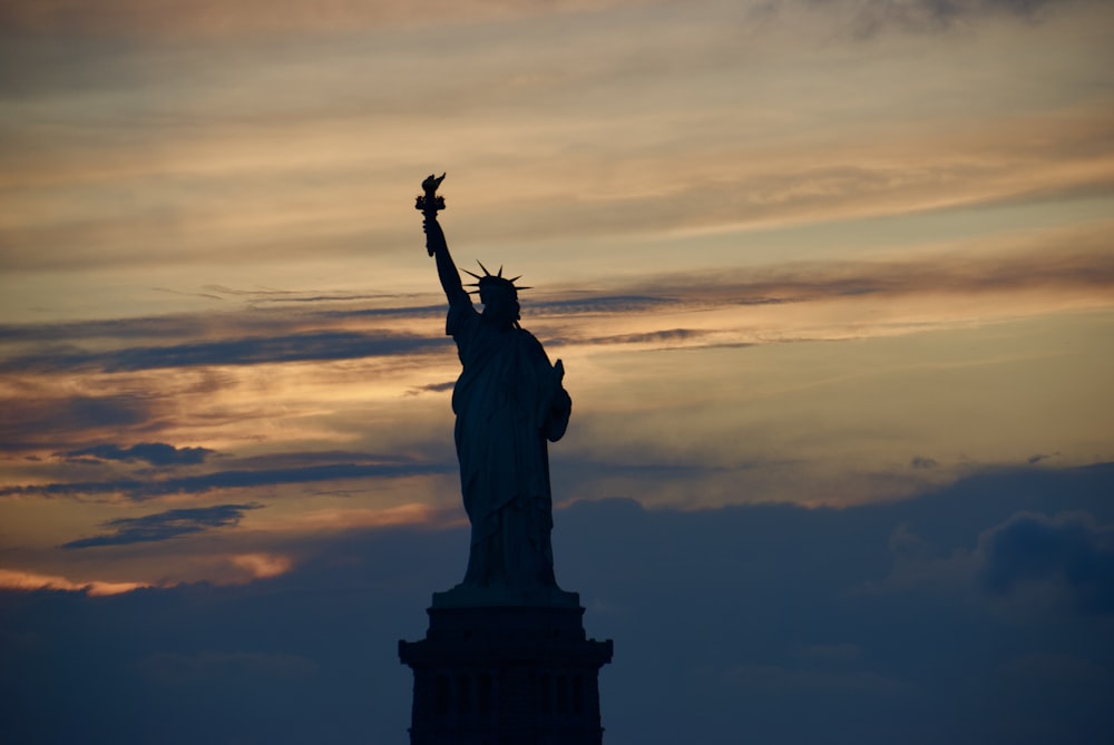 statue of liberty during sunset